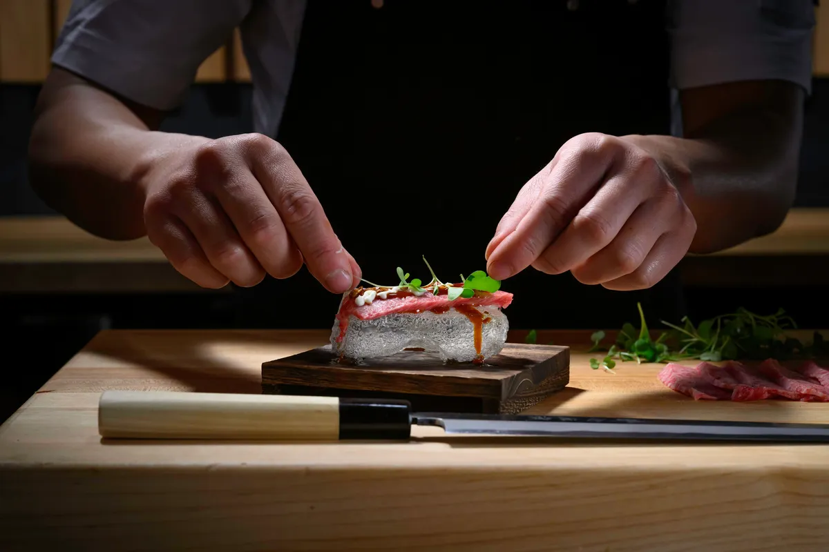 A chef plating a dish